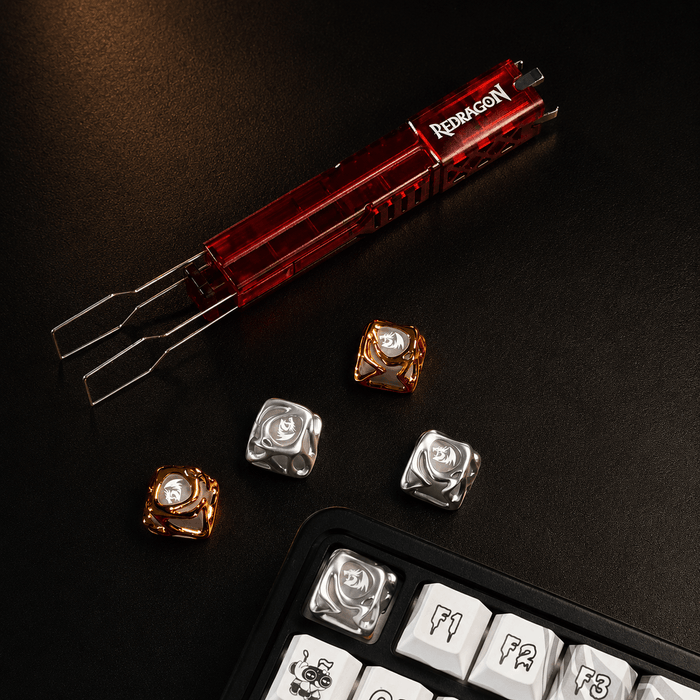 Redragon tool set with keyboard keycaps on a dark surface