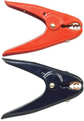 Pair of 500 amp coated parrot clamps, one red and one black, with copper jaws