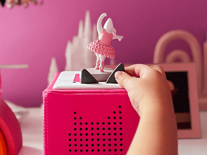 Child playing with Angelina Ballerina Tonie audio figurine and Toniebox 2