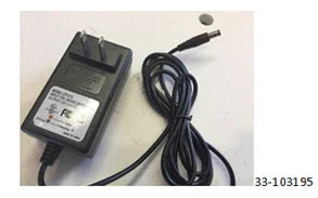 Black AC power charger with plug and cord on white surface