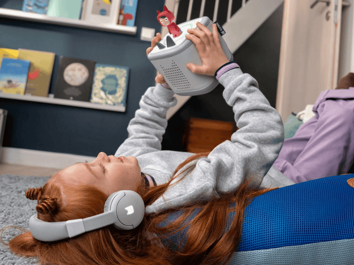 Child Listening To The Toniebox 2 And Tonie With Moon Gray Bluetooth Headphones For Kids