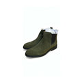 Chelsea boots featuring elastic side gores and a slim black sole.
