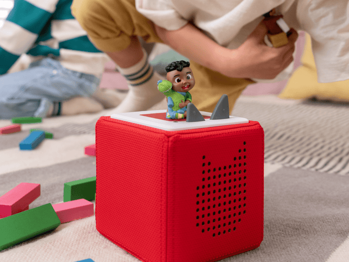 Child Playing With Cocomelon- Cody Audio Figurine And Toniebox 2