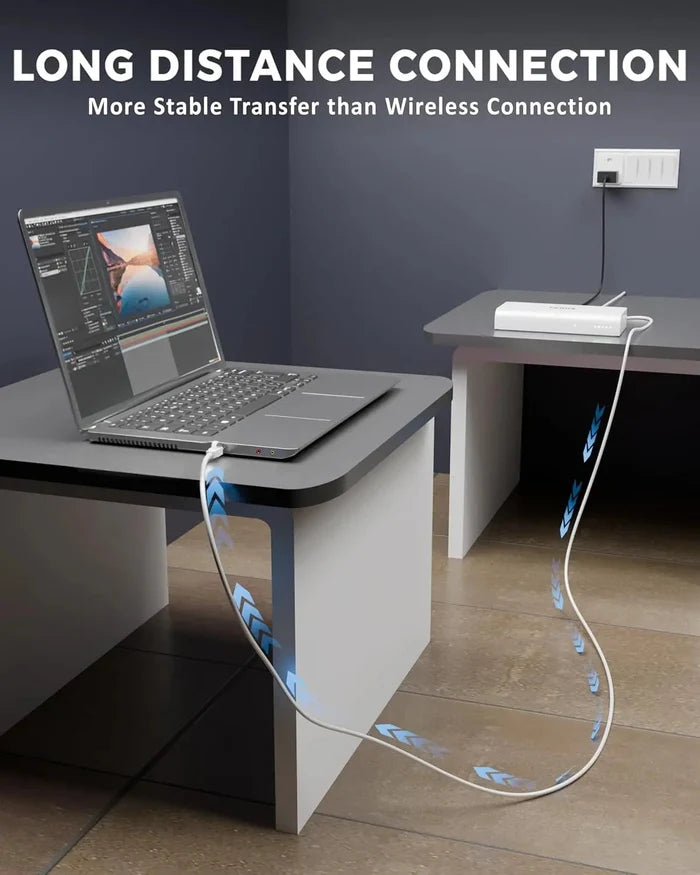 Laptop on a desk with a cable running to an extension device, emphasizing long-distance connection stability.