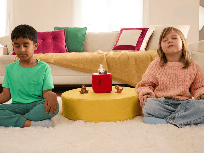 Child Playing With Yoga Tonie  Audio Figurine And Toniebox 2