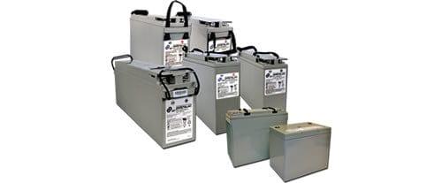 Assorted gray telecom batteries for facility power management, varying sizes, white background