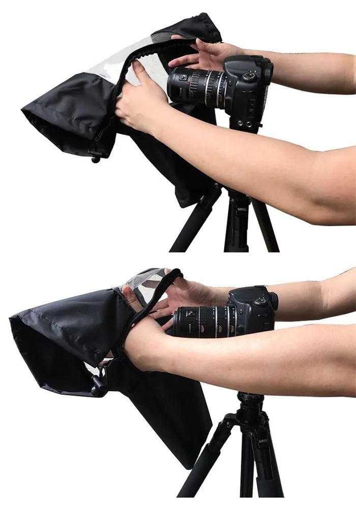 Person adjusting DSLR camera inside waterproof rain cover on tripod during outdoor photography.