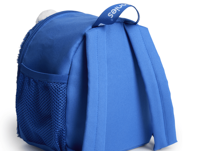 back tilted view of Toniebox Sesame Street Cookie Monster Backpack used to carry Toniebox, Tonies and accessories